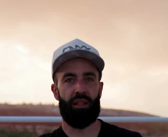 An Onyx rep talking at a lake at sunset